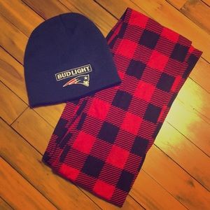 Blue winter hat and red and black plaid scarf